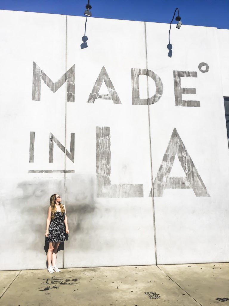 A picture in front of the made in LA wall at Melrose Avenue Walls