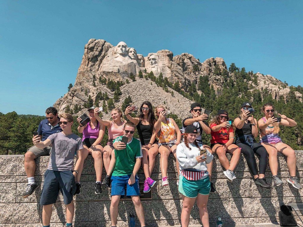 Things to bring on a road trip: Taking a Selfie at Mount Rushmore