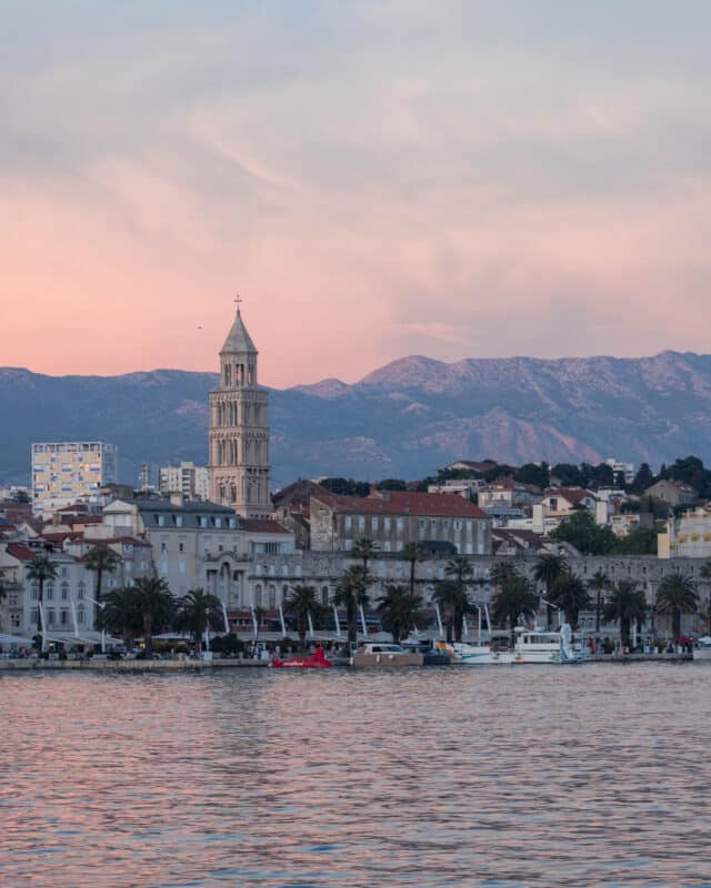 2 Weel Interrail Routes: The sunsetting in the stunning town of Split Croatia looking out at the city coastline
