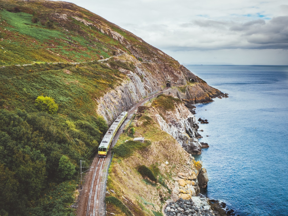 Bray to Greystone Cliffs Walk in Wicklow Ireland. Train passing the cliff edge