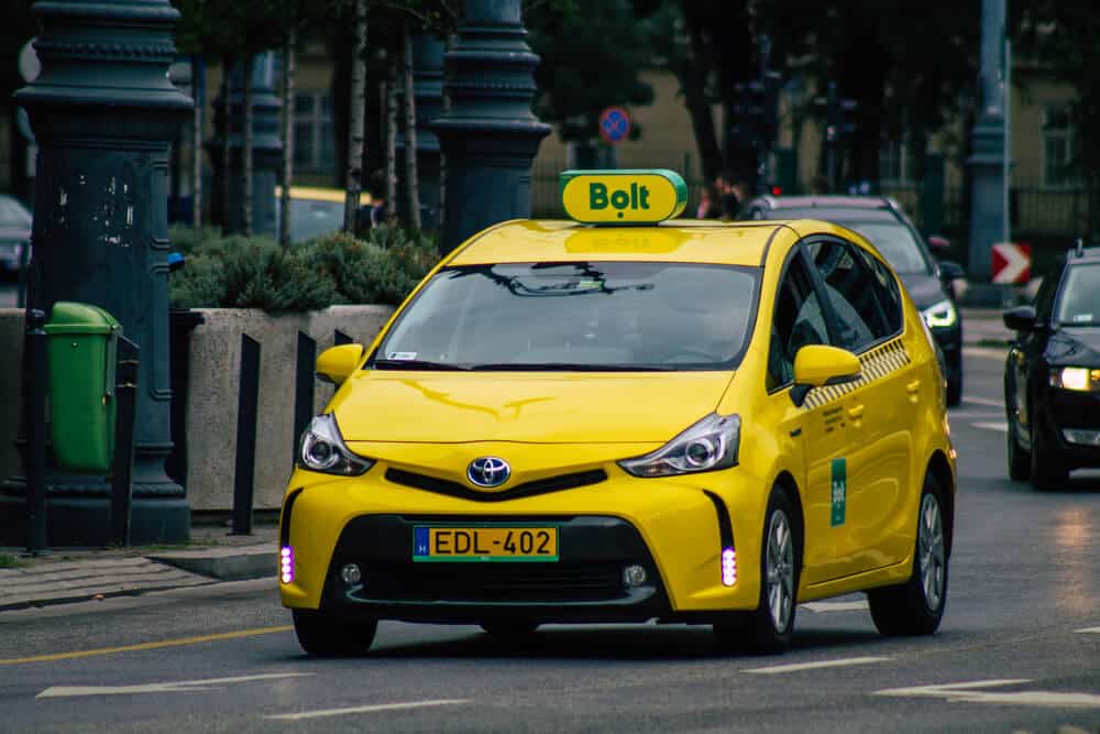 A yellow taxi in Budapest on the city street