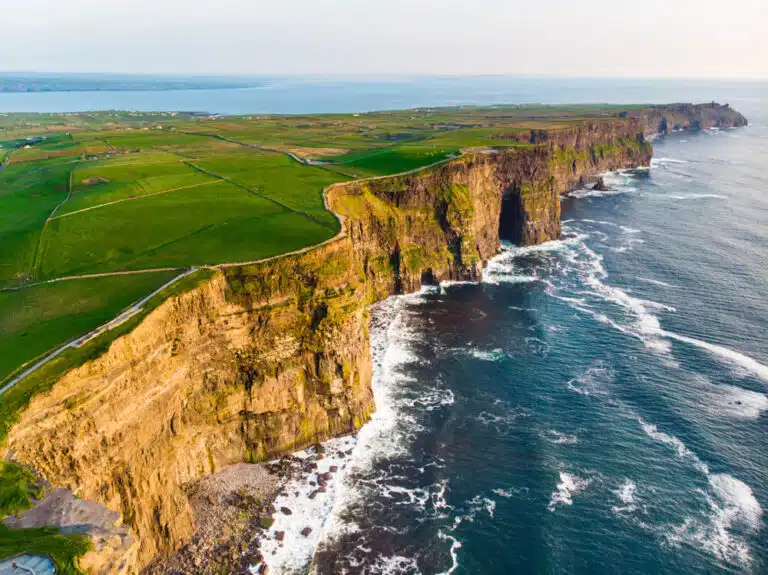 Fascinating aerial view of the majestic Cliffs of Moher in Ireland showcasing their breathtaking beauty.